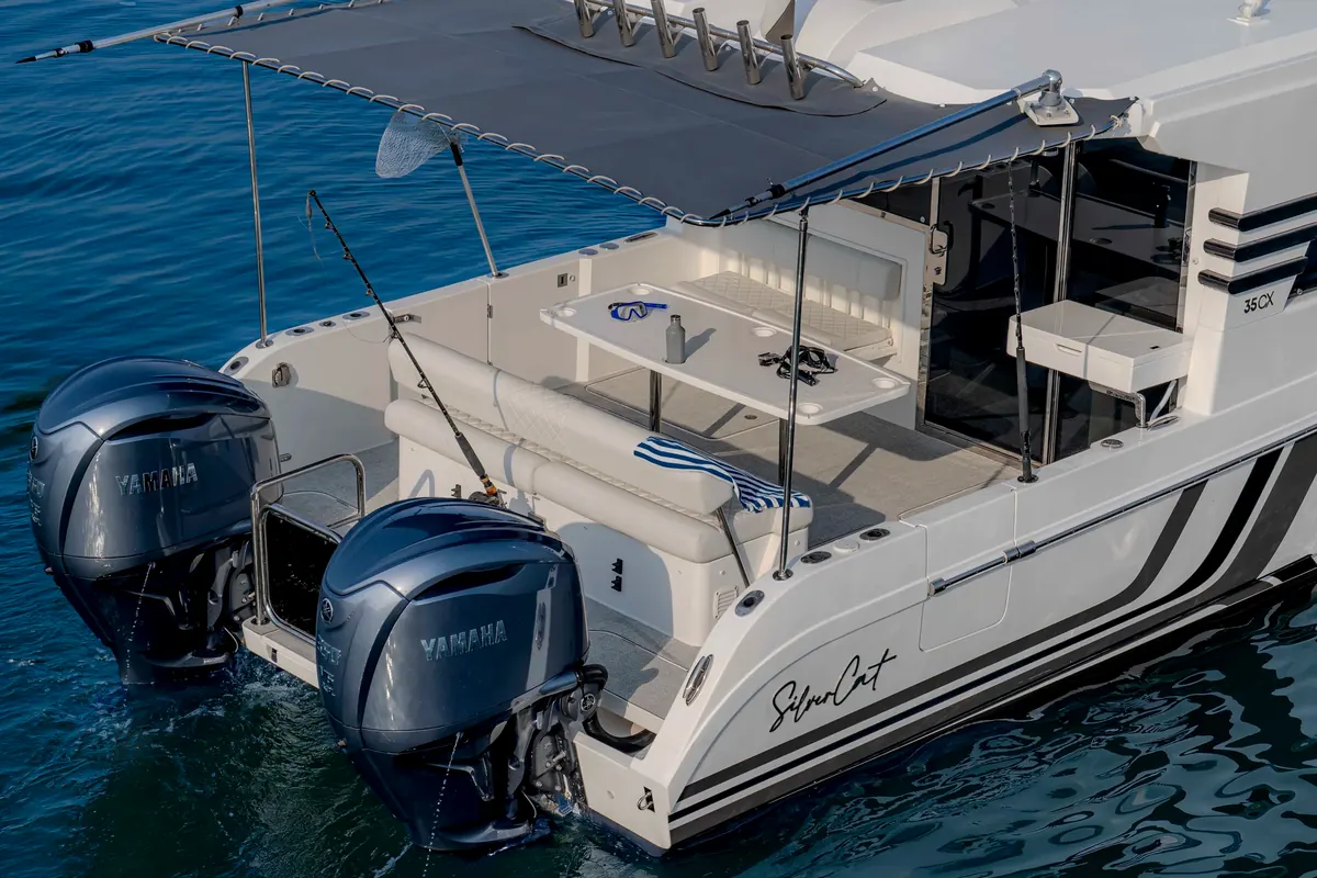 SilverCat 35CX shaded aft cockpit with table and twin outboards